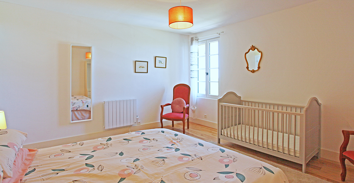 The main house first floor bedroom with king-size bed