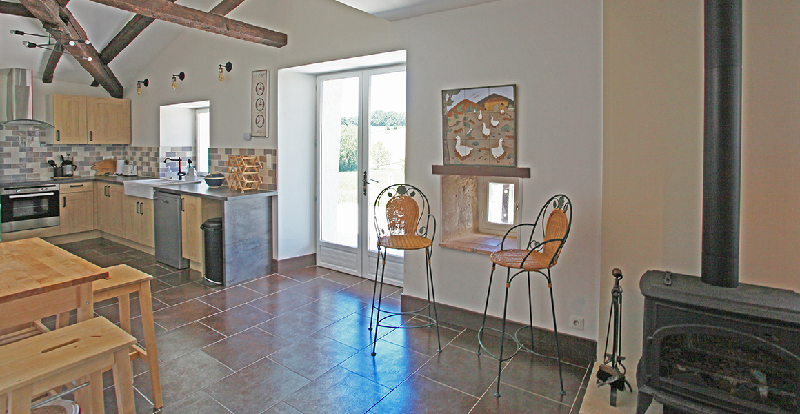 The main house kitchen leads out onto the terrace at the rear