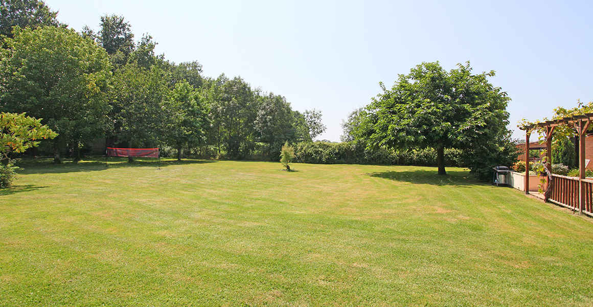 The large gardens are fully fenced and are great for ball games