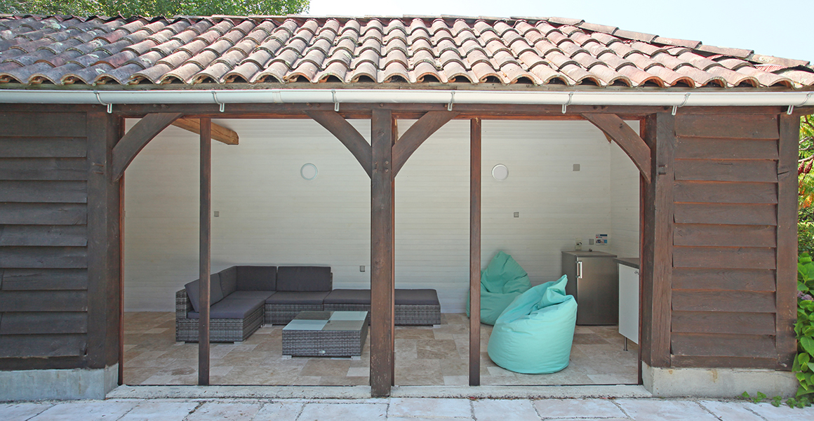 The summer house with comfortable shady seating and fridge 