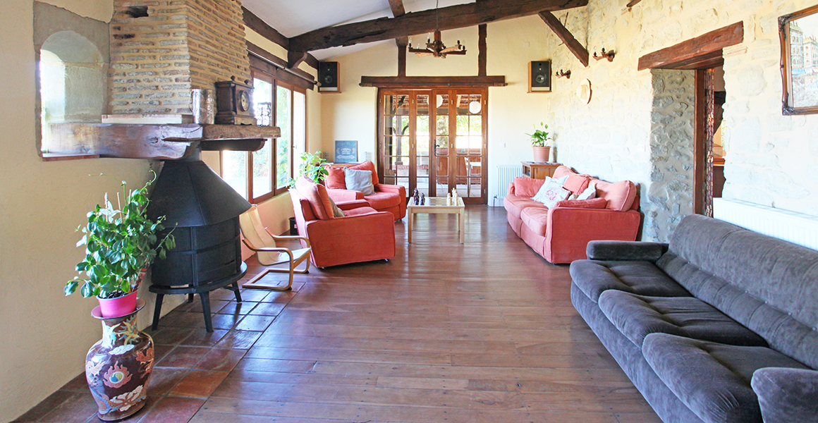 The sitting room leads to the covered terrace