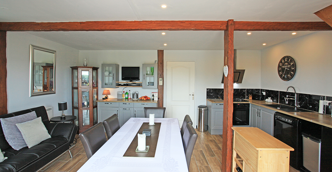 The kitchen dining area with door through to the sitting room