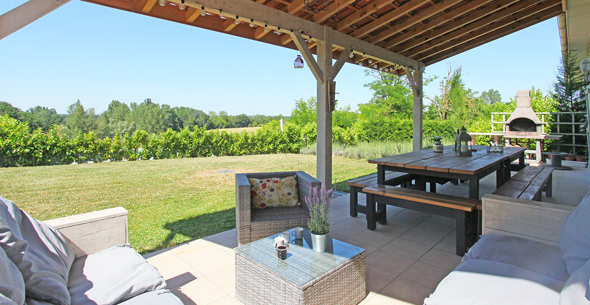 The covered terrace looking towards the pool