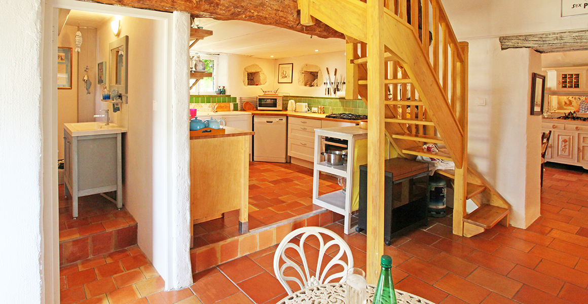 Large gite kitchen with stairs to mezzanine bedroom