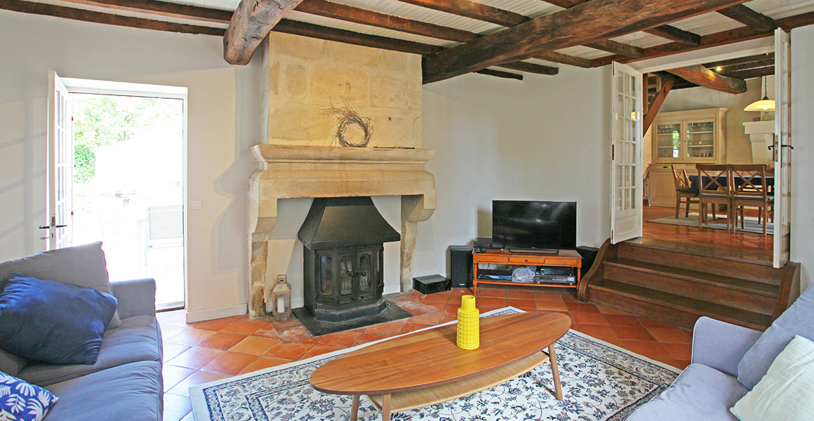 The sitting room with doors to outside terrace and dining area