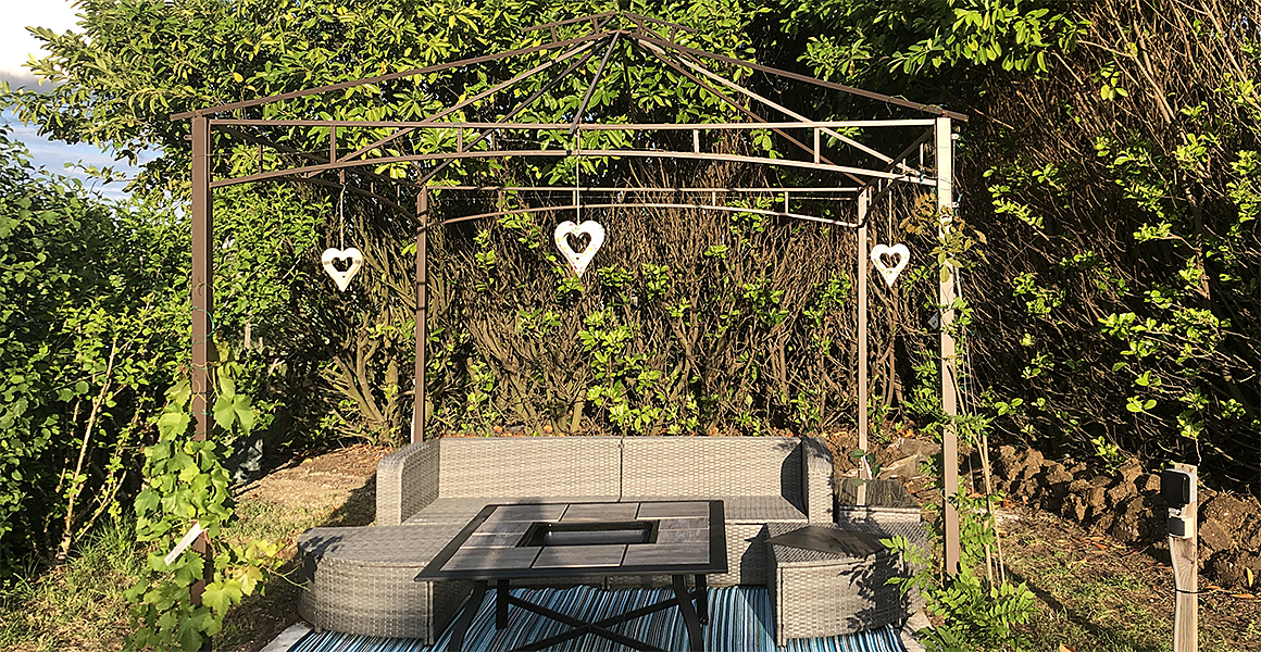 Pergola and comfortable seating in the garden