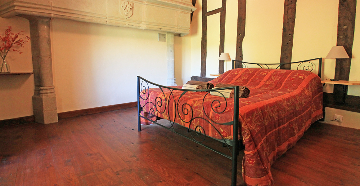 First floor double bedroom with 16th century stone fireplace 