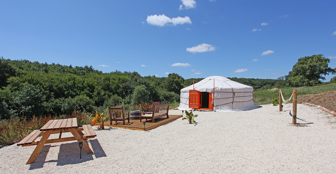 The yurt with kitchen, shower/WC and seating area