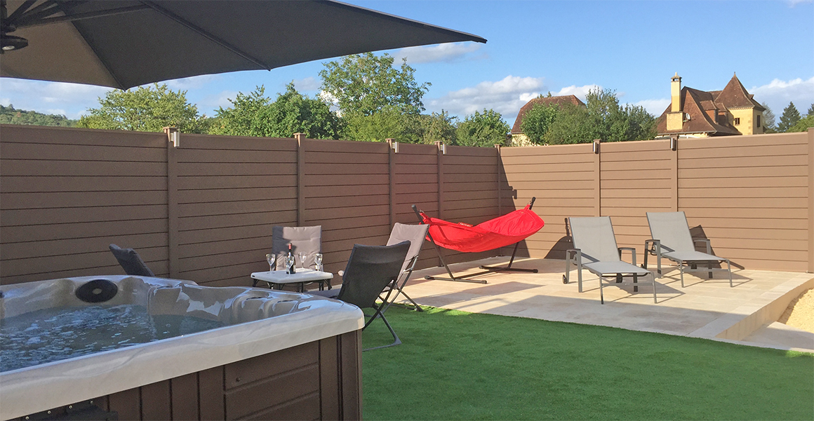 The spa hot tub and terrace towards the rear of the house