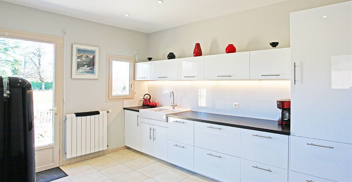 Well equipped kitchen with door out to the side and rear terraces