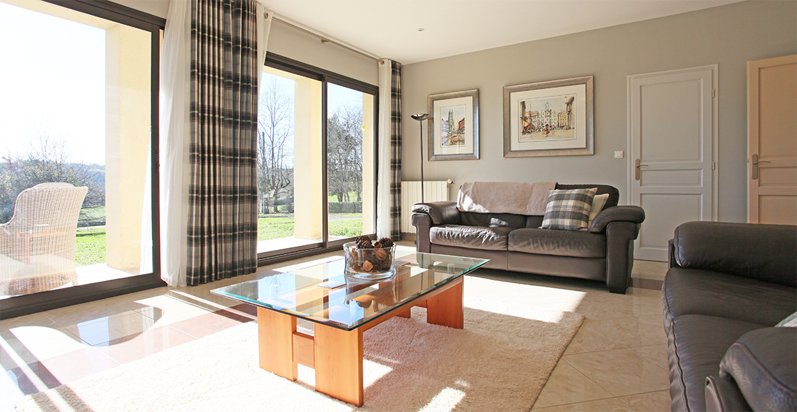 Comfortable south facing lounge with large sliding doors and access to the front and side terraces
