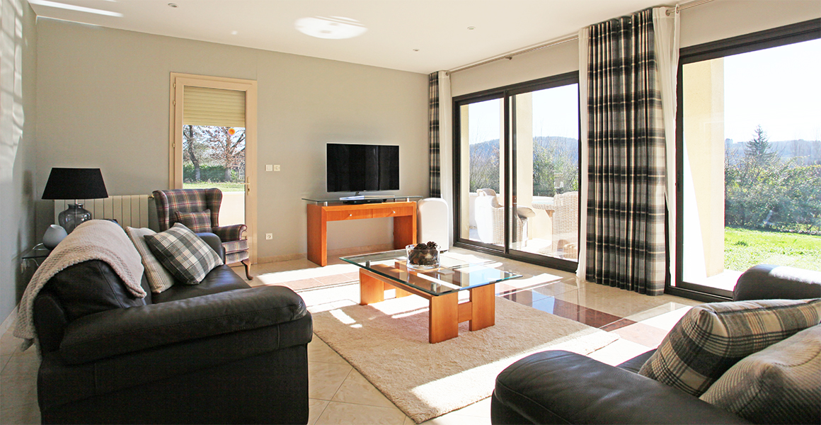 Comfortable south facing lounge with large sliding doors and access to the front and side terraces