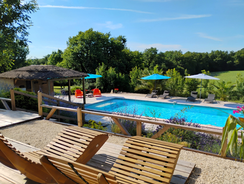 The pool overlooks fields and farmland