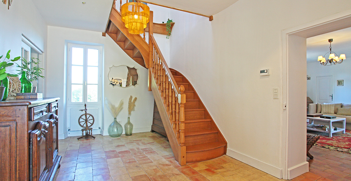 Farmhouse hallway and stairs to the first floor