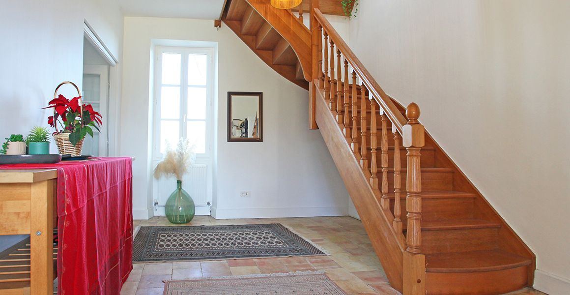 Farmhouse hallway and stairs to the first floor